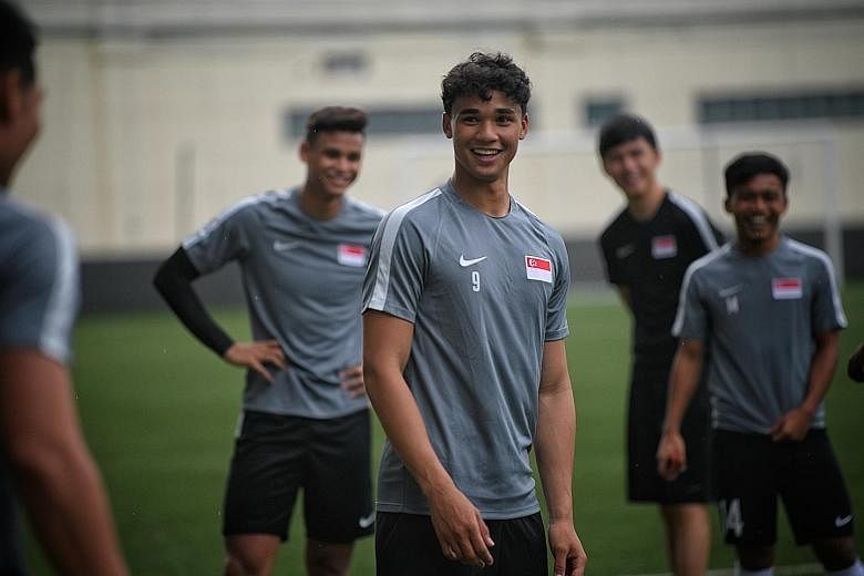 Right: Ilhan Fandi training at Geylang Field in Lorong 12 with the Young Lions. His father says that while he has the best technical abilities among the three oldest brothers, he is not as mature and developed at the same age as Irfan and Ikhsan. ST 