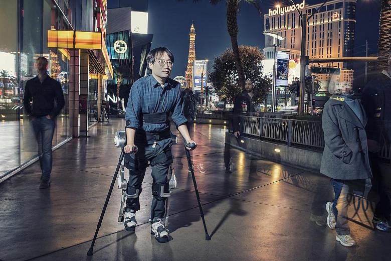 A Hyundai Motor Group researcher demonstrating the use of an exoskeleton that helps people walk. The exoskeleton market is expected to exceed US$3.4 billion (S$4.7 billion) by 2024. PHOTO: HYUNDAI MOTOR