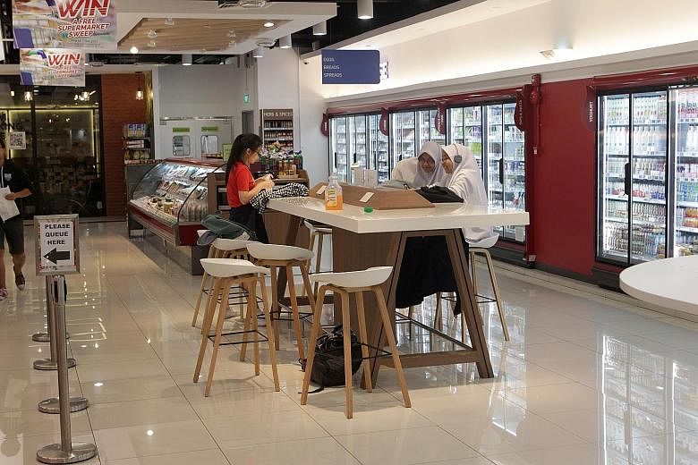 Students gathering at the Habitat by Honestbee supermarket in Pasir Panjang to study last Monday afternoon. A schoolgirl at her laptop in the Koufu food court at Sengkang General Hospital last Thursday. One of the unconventional study hot spots that 