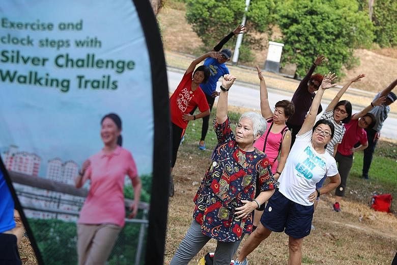 Participants of the Silver Challenge at Tampines Eco Green yesterday. The challenge features walks at iconic locations and nature parks and simple tips on healthy ageing.