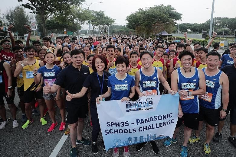 Minister for Culture, Community and Youth Grace Fu (third from left) at the start line of the SPH35-Panasonic Schools Challenge with (from left) Daniel Tan, Panasonic Singapore's director, regional business division; Joanne Ng, general manager of Panasoni