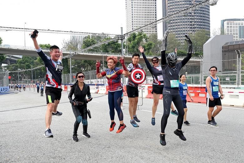 Birthday girl J. Lee, in a Captain Marvel jersey, celebrating her 42nd birthday yesterday by running the 10km race with her "superhero" friends. Here, they were seen along Republic Boulevard during the run. 