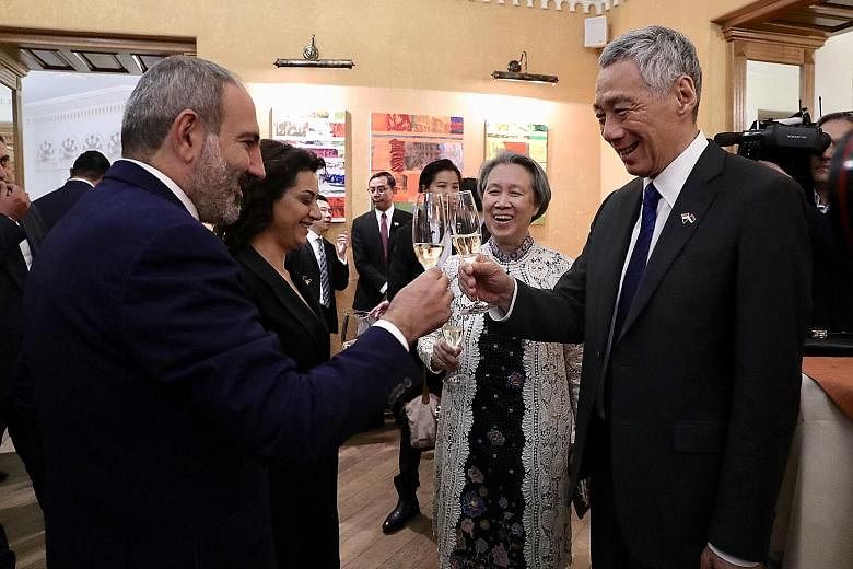 Prime Minister Lee Hsien Loong raising a toast with his Armenian counterpart Nikol Pashinyan before lunch in Yerevan yesterday. With them are Mrs Lee and Mr Pashinyan's wife, Ms Anna Hakobyan. PHOTO: MCI