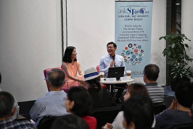 Straits Times senior political correspondent Tham Yuen-C and Associate Professor Eugene Tan of the Singapore Management University at the askST@NLB talk at the Central Library on Friday.