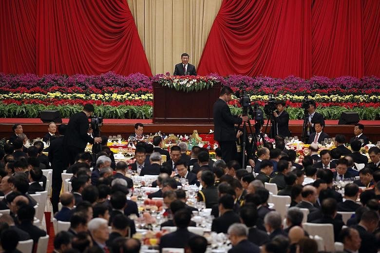 President Xi Jinping speaking at a dinner to mark the 70th anniversary of the founding of the People's Republic of China, at the Great Hall of the People in Beijing yesterday. He reiterated China's commitment to the "one country, two systems" princip
