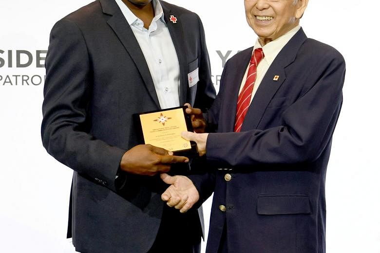 Mr Muhammad Ashik Mohamed Daud (above) was given a Commendation Award, while Mr B. Senraya Perumal (right) received the High Commendation Award from Singapore Red Cross chairman Tee Tua Ba.