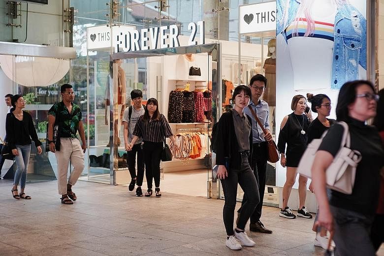 A Forever 21 outlet at 313@Somerset in Orchard Road. Mr Chang Do Won and Mrs Chang Jin Sook, founders of the US firm, which has filed for bankruptcy, borrowed US$10 million (S$13.8 million) in 2015 from the trusts for their daughters Linda Chang and 