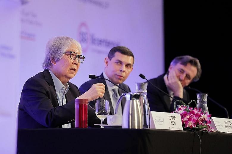 Professor Tommy Koh (far left) speaking at a dialogue at the Singapore Bicentennial Conference yesterday, with The Straits Times editor Warren Fernandez (centre), who was chairing the panel, and Bloomberg News editor-in-chief John Micklethwait. Forme