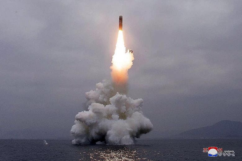 A picture from the Korean Central News Agency yesterday shows the test-firing of "the new-type SLBM Pukguksong-3" in the waters off Wonsan Bay in North Korea on Wednesday. PHOTO: AGENCE FRANCE-PRESSE