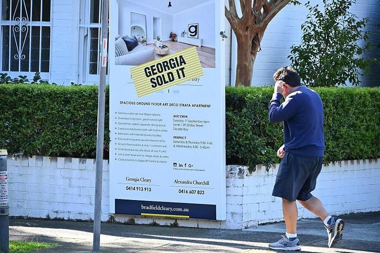 A sold sign displayed on a property in Sydney earlier this week. Australia's central bank on Tuesday lowered the cost of borrowing, slashing interest rates to 0.75 per cent amid fears about the flagging domestic economy.