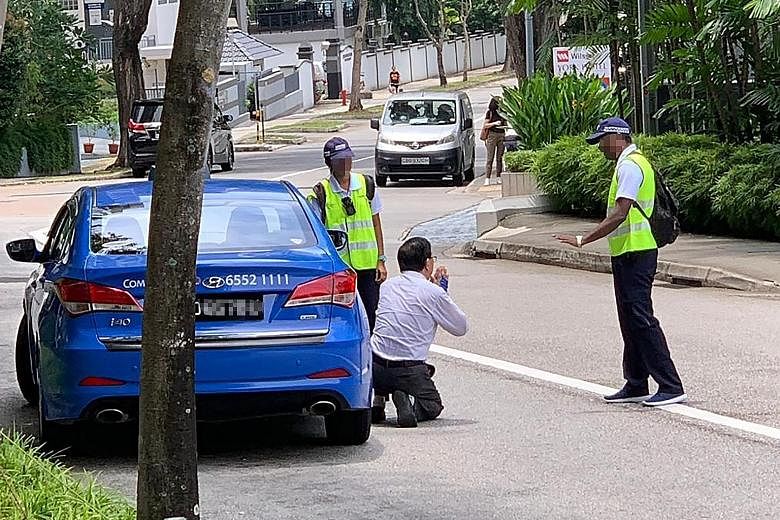 NEA said its officers caught the cabby smoking on Thursday at 12.30pm in his taxi with the windows wound down along Mount Elizabeth Road.