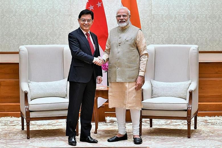 Deputy Prime Minister Heng Swee Keat meeting Indian PM Narendra Modi (left) and Bangladesh PM Sheikh Hasina in New Delhi yesterday. PHOTOS: PRESS INFORMATION BUREAU, GOVERNMENT OF INDIA; MINISTRY OF COMMUNICATIONS AND INFORMATION