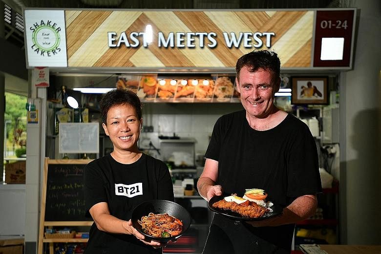 Ms Gillian Pua and Mr Michael Quinn of Shaker Lakers with the stall's sambal prawn linguine (far left) and Hainanese pork chop with rice and egg (left).
