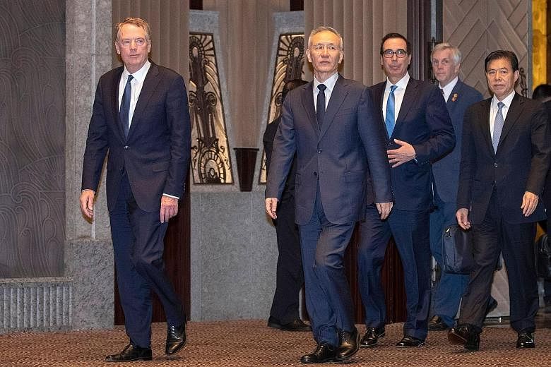 United States Trade Representative Robert Lighthizer (far left) and Treasury Secretary Steven Mnuchin (third from left) with China's Vice-Premier Liu He (centre) when they met in Shanghai in July. PHOTO: AGENCE FRANCE-PRESSE