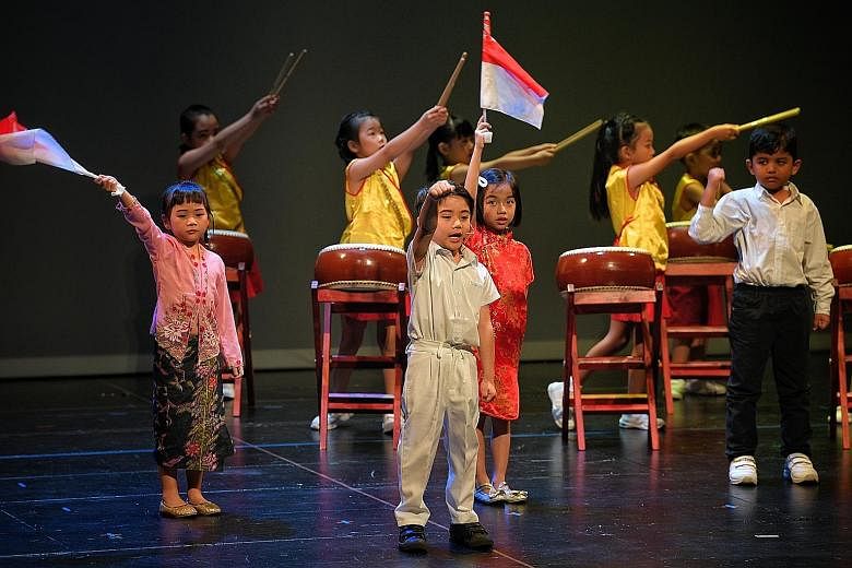 Children from PCF Sparkletots performing during the annual Family Day event held at the Victoria Theatre yesterday. ST PHOTO: MARK CHEONG