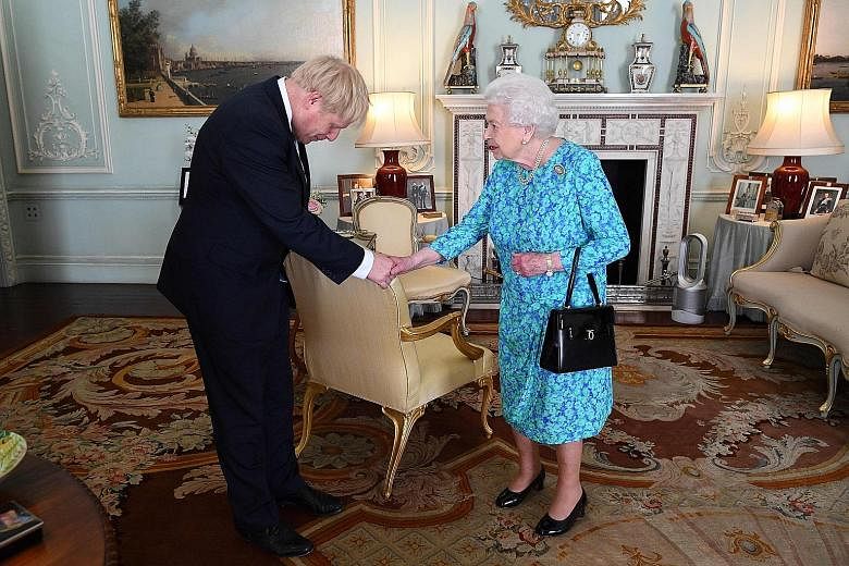 Mr Boris Johnson with Britain's Queen Elizabeth II after he was elected leader of the Conservative Party - and became Prime Minister - earlier this year. PHOTO: AGENCE FRANCE-PRESSE