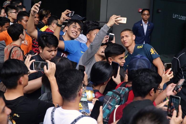 Football Neymar and Brazil teammates arrive in Singapore amid low