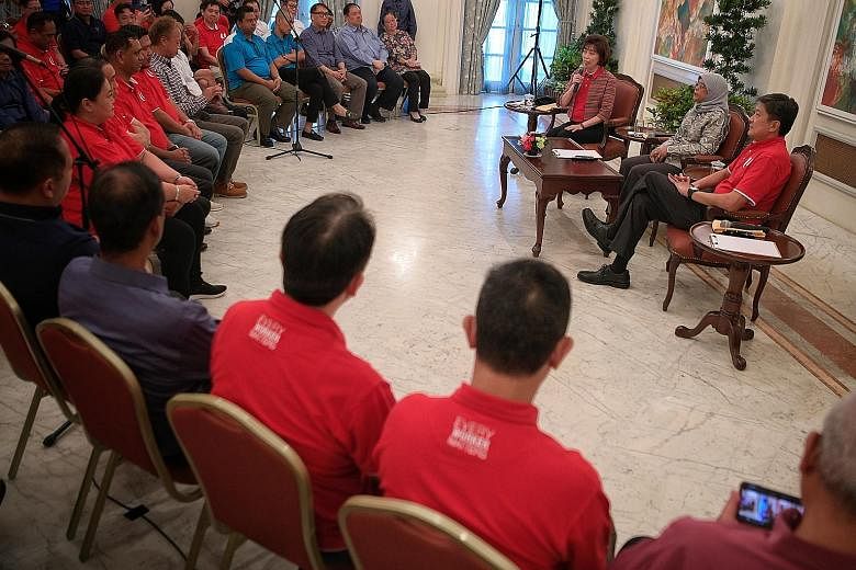 President Halimah Yacob with National Trades Union Congress president Mary Liew and its secretary-general Ng Chee Meng at yesterday's dialogue with union leaders at the Istana. The President is confident that the 24 unions in the service sector can h