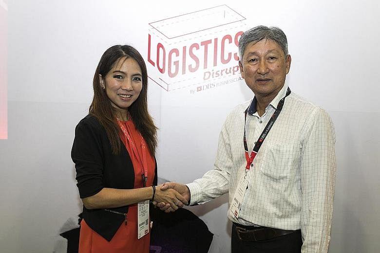 DBS Bank's Ms Tan Su Shan with Mr Ken Koh, group CEO of Yang Kee Logistics, the first company to sign up for the bank's digital logistics solutions package. PHOTO: DBS