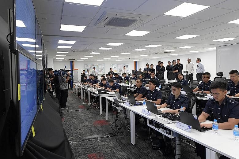 Mr Shanmugam visiting the Home Team Joint Facility in Kallang Fire Station. It includes a main command room where personnel from the police, Singapore Civil Defence Force and other agencies will work together. Home Affairs and Law Minister K. Shanmug