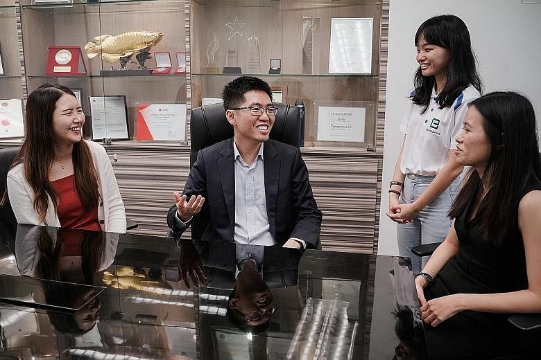 Mr Lawrence Chai, founder and director of 3E Accounting, with (from left) the firm's consultant Dorothy Soh, digital marketing executive Sng Qi Wen and human resources executive Ho Li Fui. The firm became unionised last month and is sponsoring NTUC m