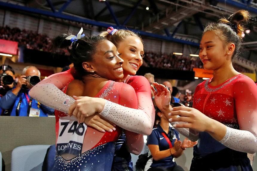 Top: Nikita Nagornyy displaying his prowess on the high bar to seal the men's team gold for Russia, the first European country to win the title since 2001. Simone Biles celebrating with her US teammates Jade Carey and Sunisa Lee after clinching the f