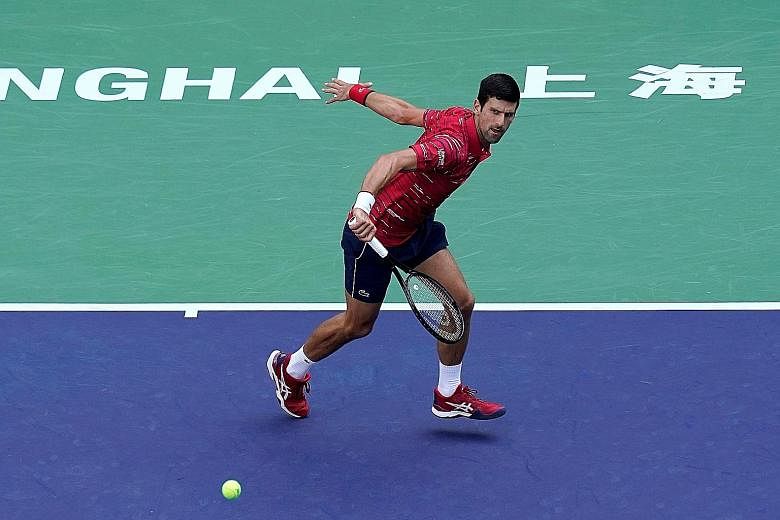 World No. 1 Novak Djokovic en route to defeating American John Isner 7-5, 6-3 yesterday. He will play Greece's Stefanos Tsitsipas in the Shanghai Masters quarter-finals today. PHOTO: REUTERS