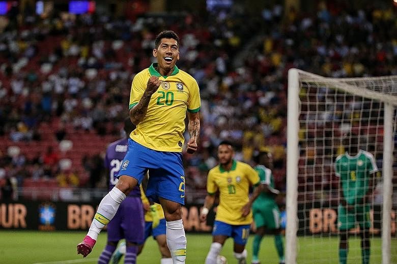 Top: Roberto Firmino celebrating his goal which put Brazil in the lead. ST PHOTO: KEVIN LIM