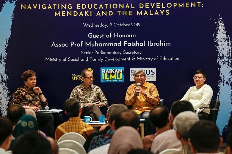 (From left) Dr Azhar Ibrahim, who moderated the dialogue, with Associate Professor Mukhlis Abu Bakar, Professor Yaacob Ibrahim and Ms Siti Hazirah Mohamad. They were speaking at a dialogue on self-help group Yayasan Mendaki's latest book (above). PHO