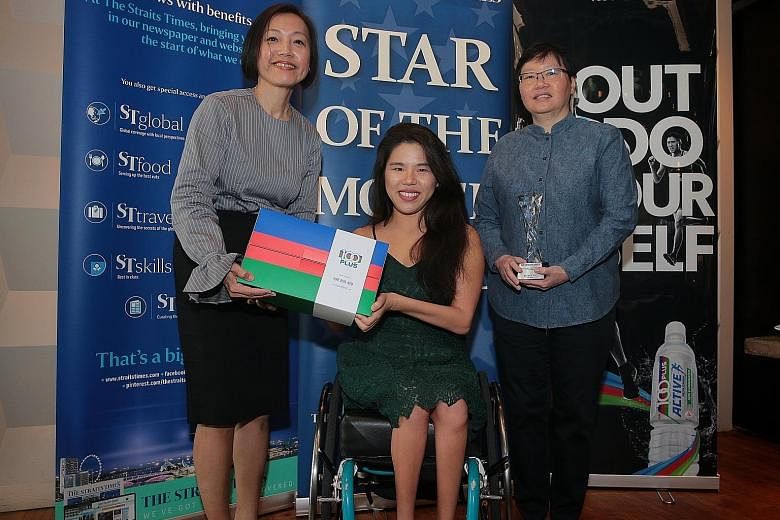 Yip Pin Xiu receiving the ST Star of the Month award for September from managing director of F&N Foods Jennifer See (left) and ST sports editor Lee Yulin yesterday. She won the 50m and 100m backstroke S2 at the World Para Swimming Championships. ST P