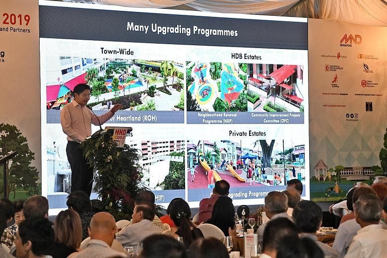 National Development Minister Lawrence Wong speaking at the annual MND Huddle yesterday at Fort Canning Park. He said the upgrading projects would also offer "a healthy pipeline of public sector projects", providing opportunities for consultants and 