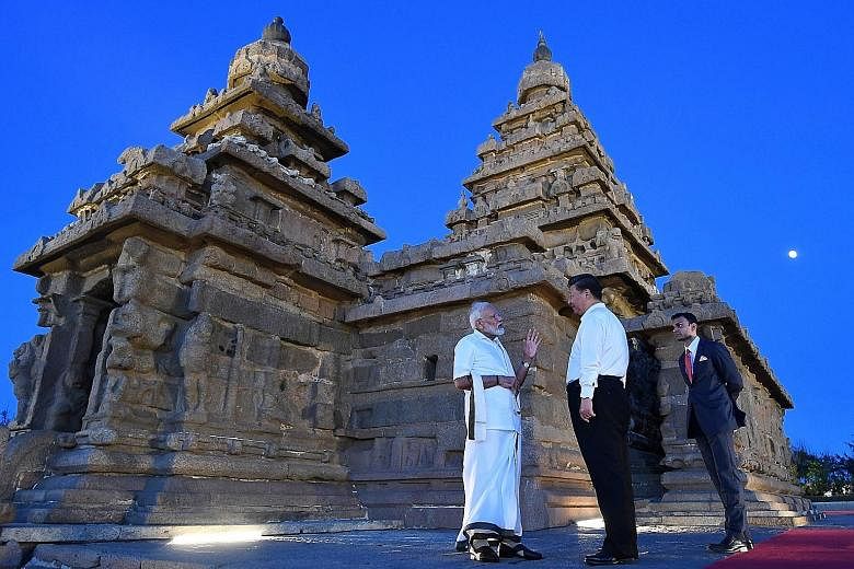 Indian Prime Minister Narendra Modi and Chinese President Xi Jinping visiting the Shore Temple in Mamallapuram on Friday during the two leaders' second annual summit in the southern seaside Indian town. 