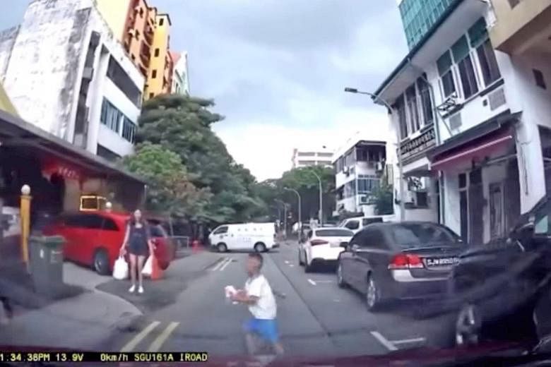 Children and road safety are a key concern. From left: A screengrab shows a boy sprinting in front of a car across Geylang Lorong 9 last Monday; in this screengrab, a boy is seen in front of an oncoming car last Saturday, and he is later shown lying 