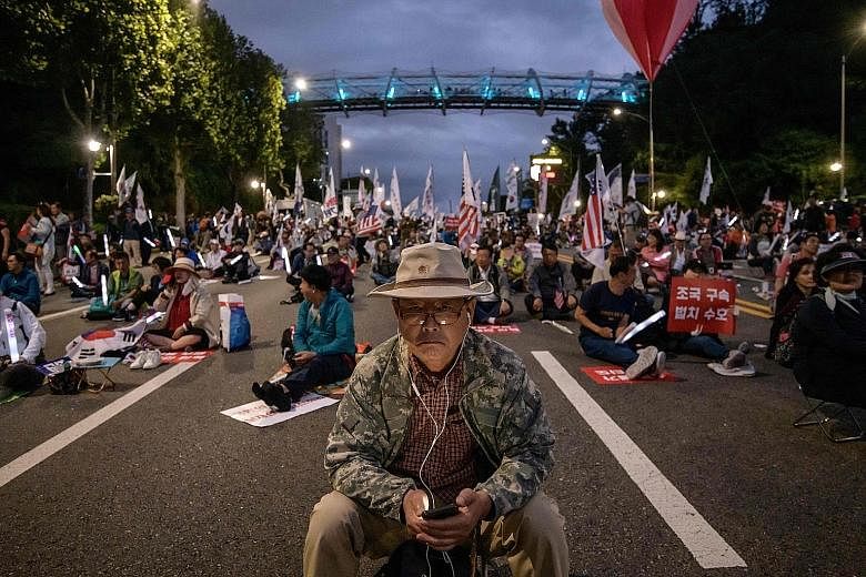 Supporters of Justice Minister Cho Kuk, taking to the streets in Seoul on Saturday. His supporters insist that the allegations against him are exaggerated by the opposition and believe that the prosecution is trying to bring him down so as to stop hi