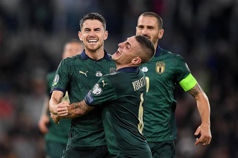 Italy's Jorginho celebrating with Marco Verratti after scoring their first goal from the penalty spot. The Azzurri defeated Greece 2-0. 