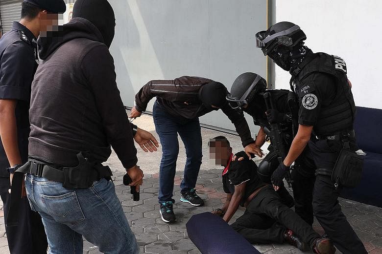 Counter-terror police in Malaysia arresting men, said to be sympathisers of the defunct Liberation Tigers of Tamil Eelam in Sri Lanka, last Saturday in Melaka and Penang. Two ethnic Indian Democratic Action Party assemblymen were among the 12 men nab
