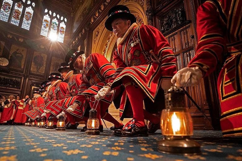 The Queen returning to Buckingham Palace in the Diamond Jubilee State Coach after the opening of Parliament. PHOTO: AGENCE FRANCE-PRESSE Yeoman warders performing a traditional "ceremonial search" in the Prince's Chamber in the House of Lords before 
