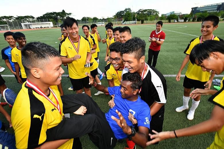 Jubilant members of Guangyang Secondary School's football team carrying coach Arumugam Kaliappan after winning the Schools National B Division League Two title in April. Arumugam and Northbrooks Secondary's Sanjay Radakrishna (above) were among 10 re