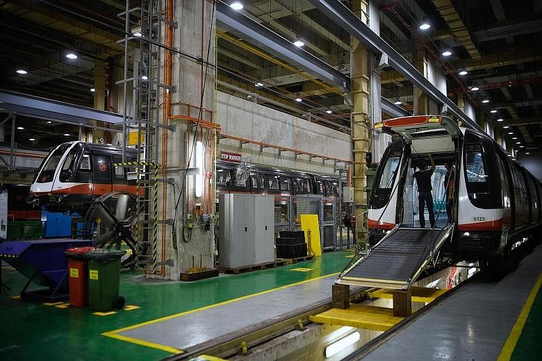 Trains at the train workshop in the SMRT Kim Chuan Depot last year. Transport Minister Khaw Boon Wan said Singapore has corrected the under-investment in operations and maintenance, but warned against going overboard in future, at the expense of comm