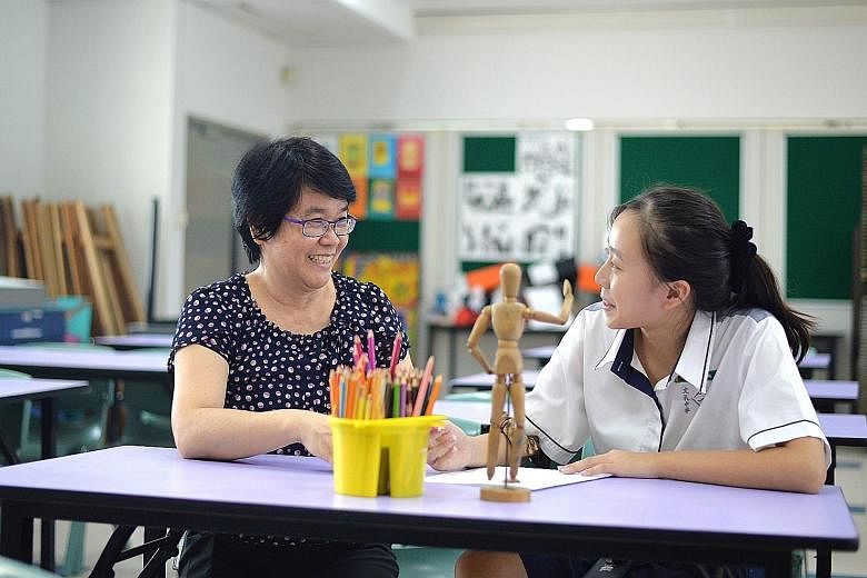 Boon Lay Secondary School teacher Sim Siok Siok with her student Esther Soon, a Normal Technical student who joined a Normal Academic art class through the pilot programme. The new scheme allows students to take "out-of-stream" subjects - a concept s