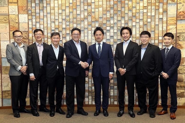 From left: SPH's chief financial officer Chua Hwee Song, head of capital markets Loh Yew Seng, deputy chief executive Anthony Tan, and chief executive Ng Yat Chung with Bridge C Capital's CEO Daizo Yokota, and Singapore-based chairman Aki Tokuyama, S