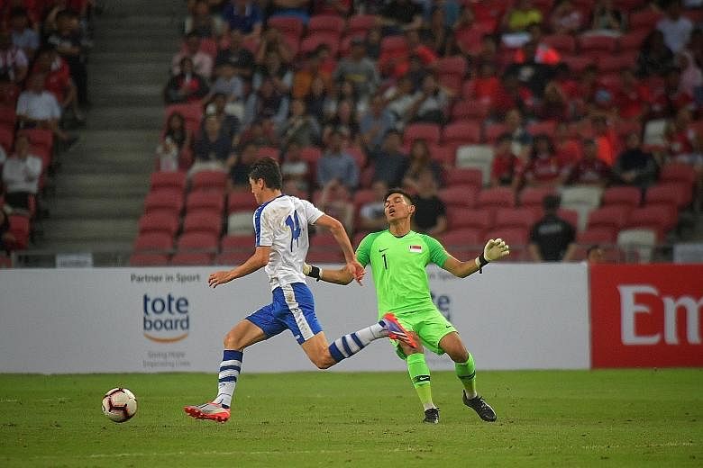 Left: Uzbekistan's Eldor Shomurodov, their two-goal hero, missing an open goal after rounding Singapore goalkeeper Izwan Mahbud in the second half of their World Cup Asian Zone Group D qualifier. Singapore had gone into the break with the game poised