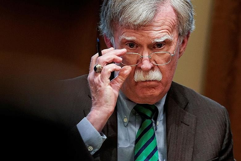 Ms Fiona Hill (above), former senior director for Russian and Eurasian affairs, leaving after testifying in the impeachment inquiry into US President Donald Trump in Washington on Monday. She said then national security adviser John Bolton (below) in