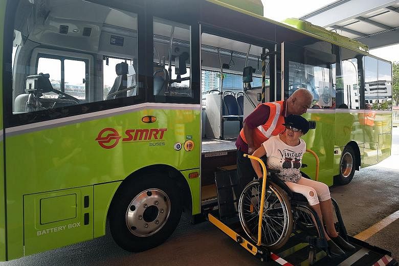 Left: The expanded Yio Chu Kang bus interchange boasts green features, wheelchair-friendly boarding points and more bicycle parking spaces. Above: Ms Wendy Tan boarding service 825's new electric minibus with the help of bus captain Ramli Khamis yest