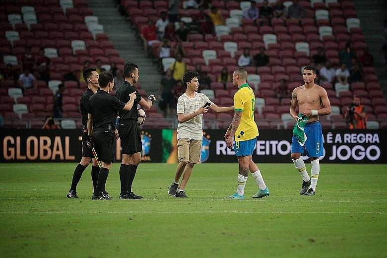 A young pitch invader running onto the field at the National Stadium after the friendly match between Brazil and Senegal last Thursday. Another pitch invader was seen approaching Brazil forward Gabriel Jesus at the same match. They were both apprehen