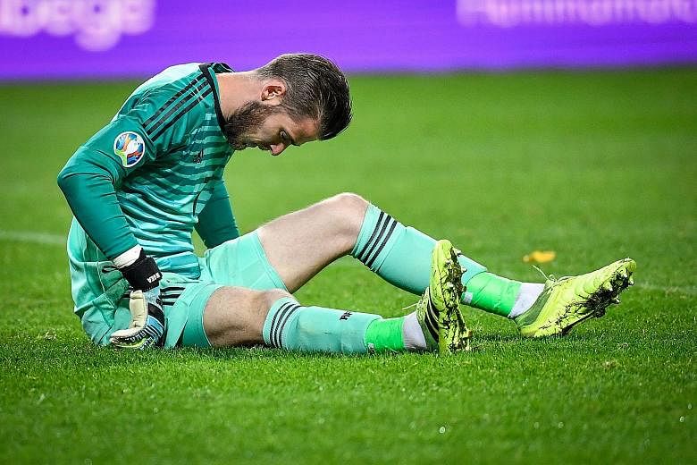 Spain goalkeeper David de Gea is injured during the 1-1 Euro 2020 qualifying draw with Sweden on Tuesday. The result meant that Spain have qualified. PHOTO: AGENCE FRANCE-PRESSE