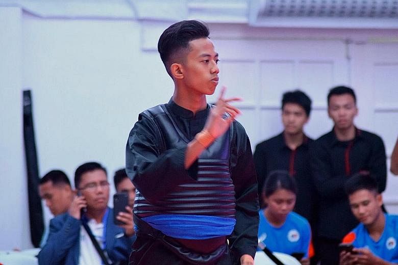 Hazim Yusli at the South-east Asian Sultan's Pencak Silat Championship this week. The 17-year-old had to settle for the silver after withdrawing from the Class B final. Singapore ended second on the medal tally with two golds, six silvers and two bro