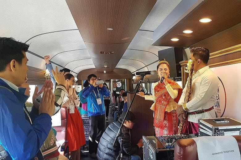 Participants on board the Asean-Korea Train watching a performance yesterday. Some 200 delegates from 10 Asean member states and South Korea took the one-time train travelling towards the southern port city of Busan in the lead up to the Asean-Korea 
