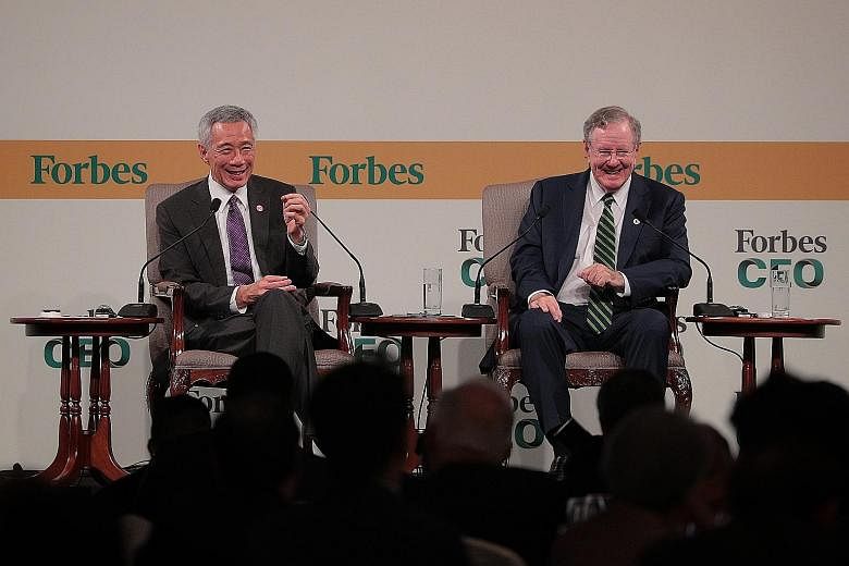 Prime Minister Lee Hsien Loong in a dialogue with Mr Steve Forbes, chairman and editor-in-chief of Forbes Media, at the Forbes Global CEO Conference yesterday. The hour-long dialogue covered a broad range of topics, including the US-China trade tensi