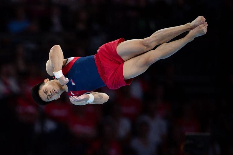 Carlos Yulo of the Philippines twisting to the floor exercise title at the Gymnastics World Championships in Stuttgart last Saturday. PHOTO: EPA-EFE